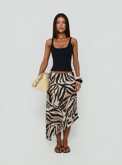Featuring the Suella Asymmetrical Midi Skirt Zebra in womens-skirts with animal-leopard print and fitted silhouette front view of model wearing Princess Polly