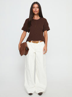 side view of model wearing Princess Polly Ramos Low Rise Wide Leg Jeans White Low Rise Jeans 