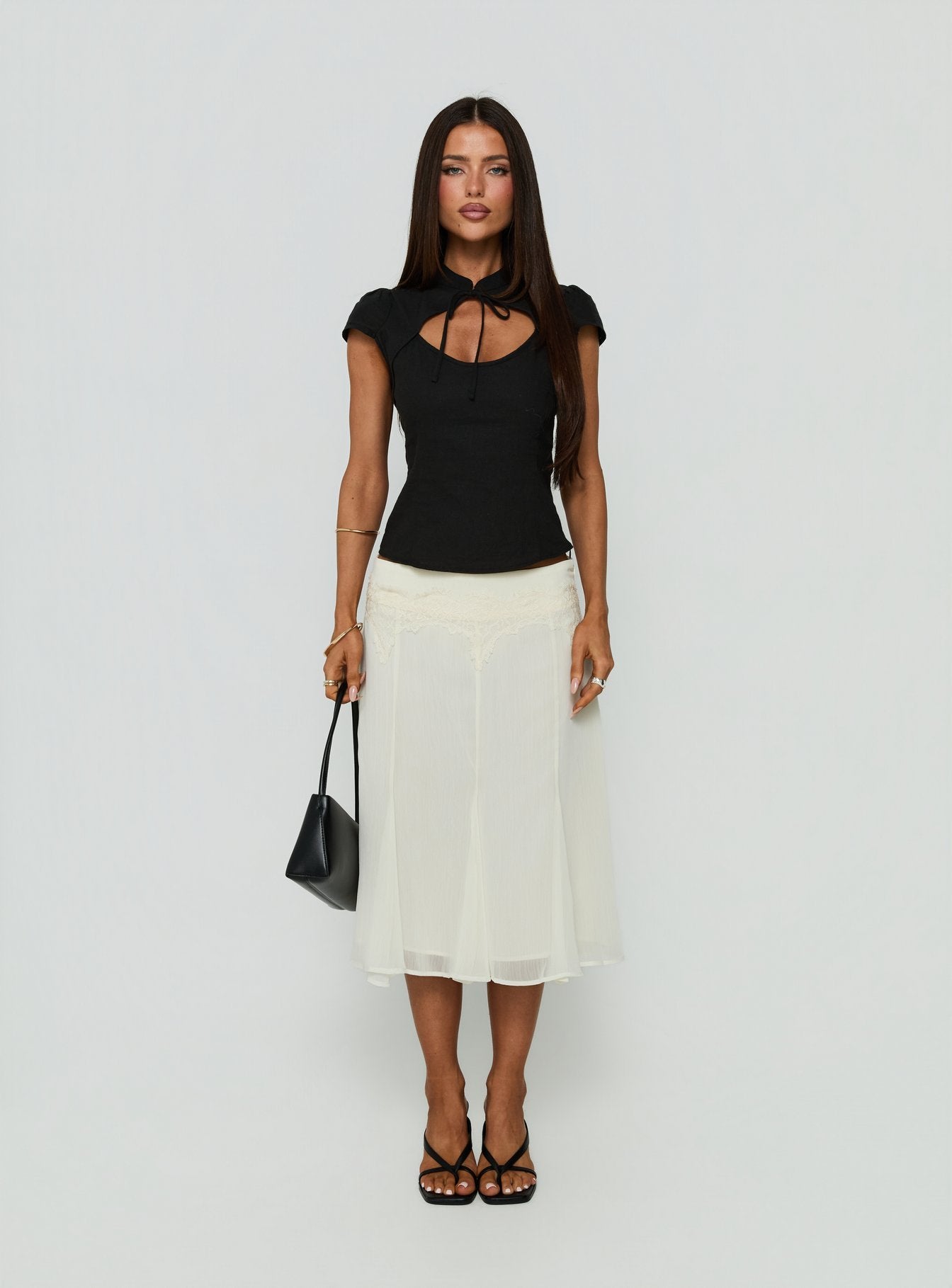 Showcasing the Ambrosea Panelled Midi Skirt Cream womens-skirts with midi length front view of model wearing Princess Polly