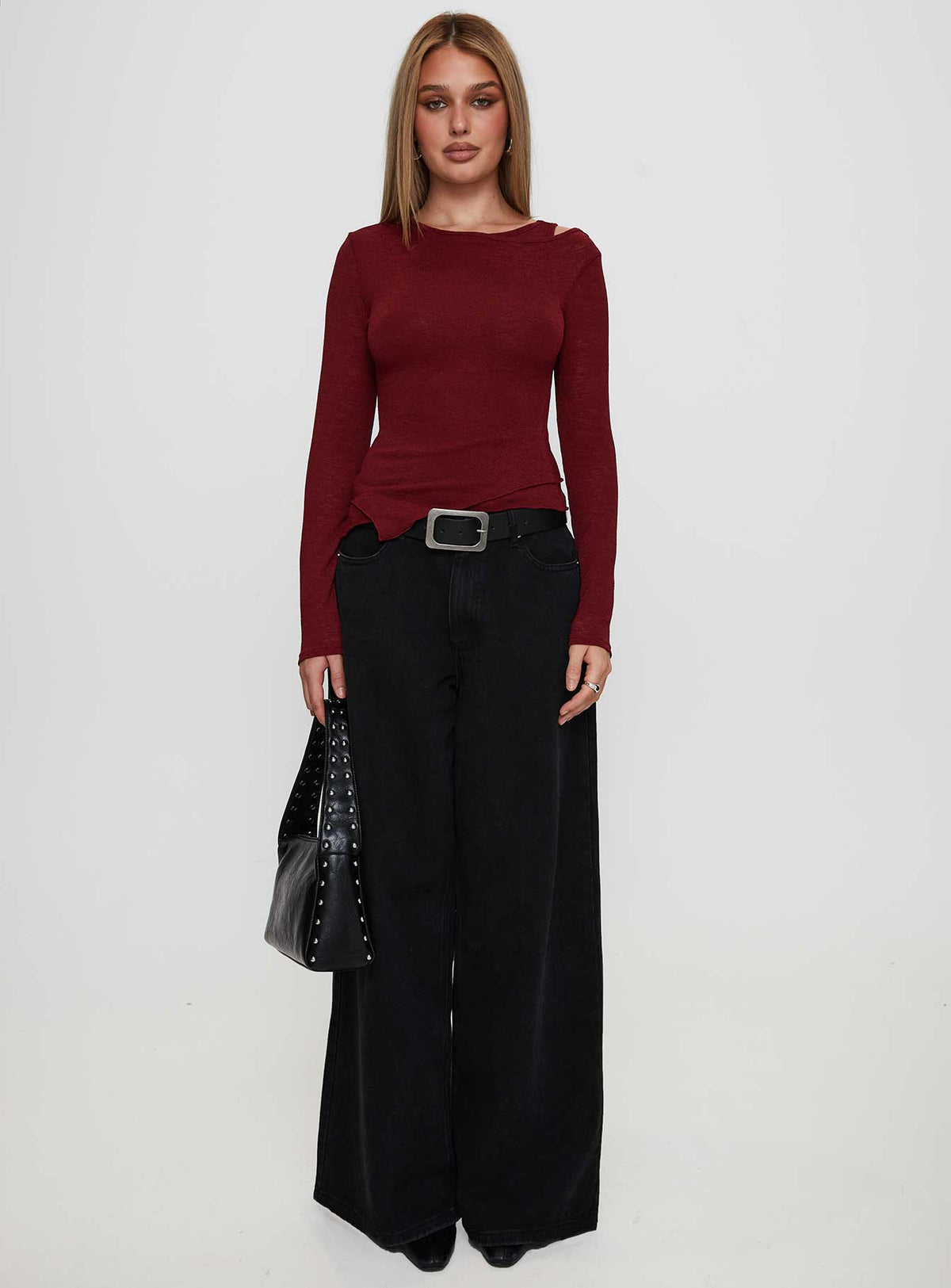 side view of model wearing Princess Polly Lefort Long Sleeve Top Burgundy Full Sleeves Crew Neck 