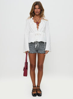 front view of model wearing Princess Polly Harloe Ruched Tie Up Long Sleeve Top White Full Sleeves V-Neck 