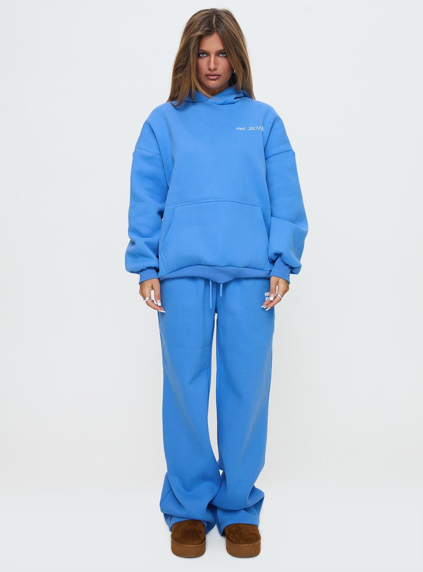front view of model wearing Princess Polly Princess Polly Wide Leg Track Pant Bubble Text Blue High Rise Pants Pants 