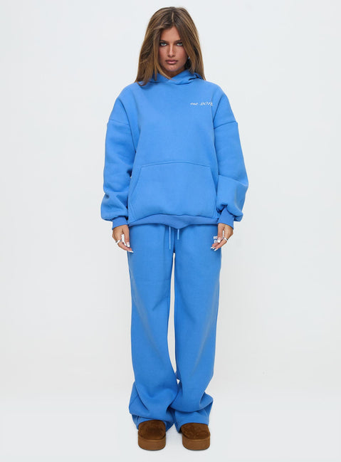front view of model wearing Princess Polly Princess Polly Wide Leg Track Pant Bubble Text Blue High Rise Pants Pants 