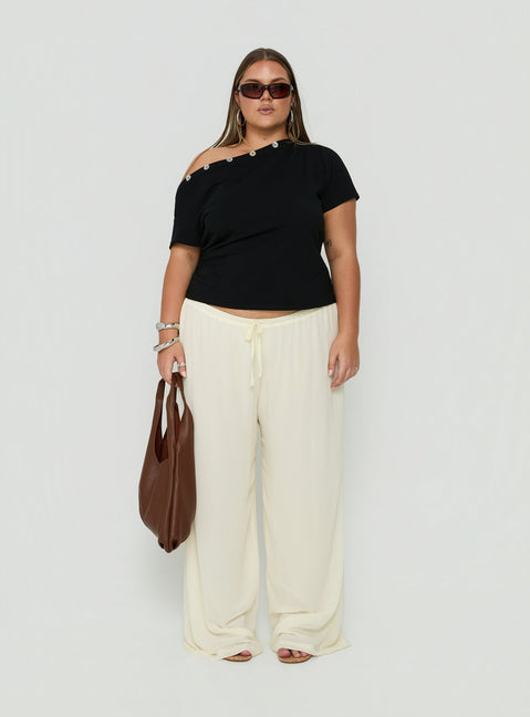 Showcasing Finesse Pants Yellow Curve womens-regular-pants with mid-rise front view of model wearing
