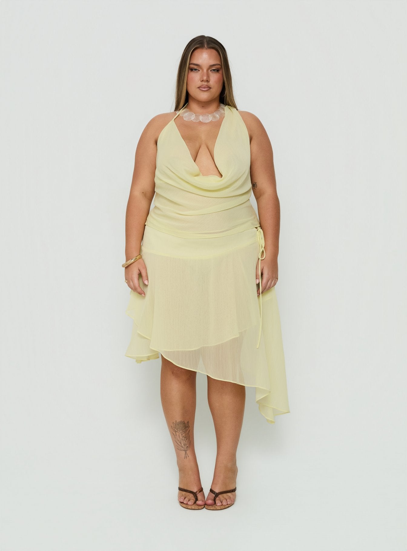 Showcasing the Evaleine Asymmetrical Chiffon Midi Skirt Baby Yellow Curve womens-skirts in midi length product Princess Polly