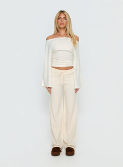 side view of model wearing Princess Polly Felisha Low Waist Knit Pants White Mid Rise Pants 