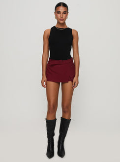 front view of model wearing Princess Polly Centre Stage Cut Out Bodysuit Black Sleeveless 