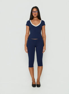 Featuring the Rowanna Sporty Capri Pants Navy / Cream womens-regular-pants with high-rise front view of model wearing