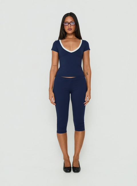 Featuring the Rowanna Sporty Capri Pants Navy / Cream womens-regular-pants with high-rise front view of model wearing