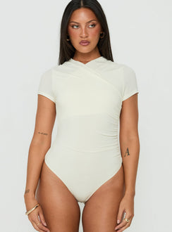 Discover the Odettea Cross Front Short Sleeve Bodysuit in Cream womens-bodysuit with short sleeves front view of model wearing Princess Polly