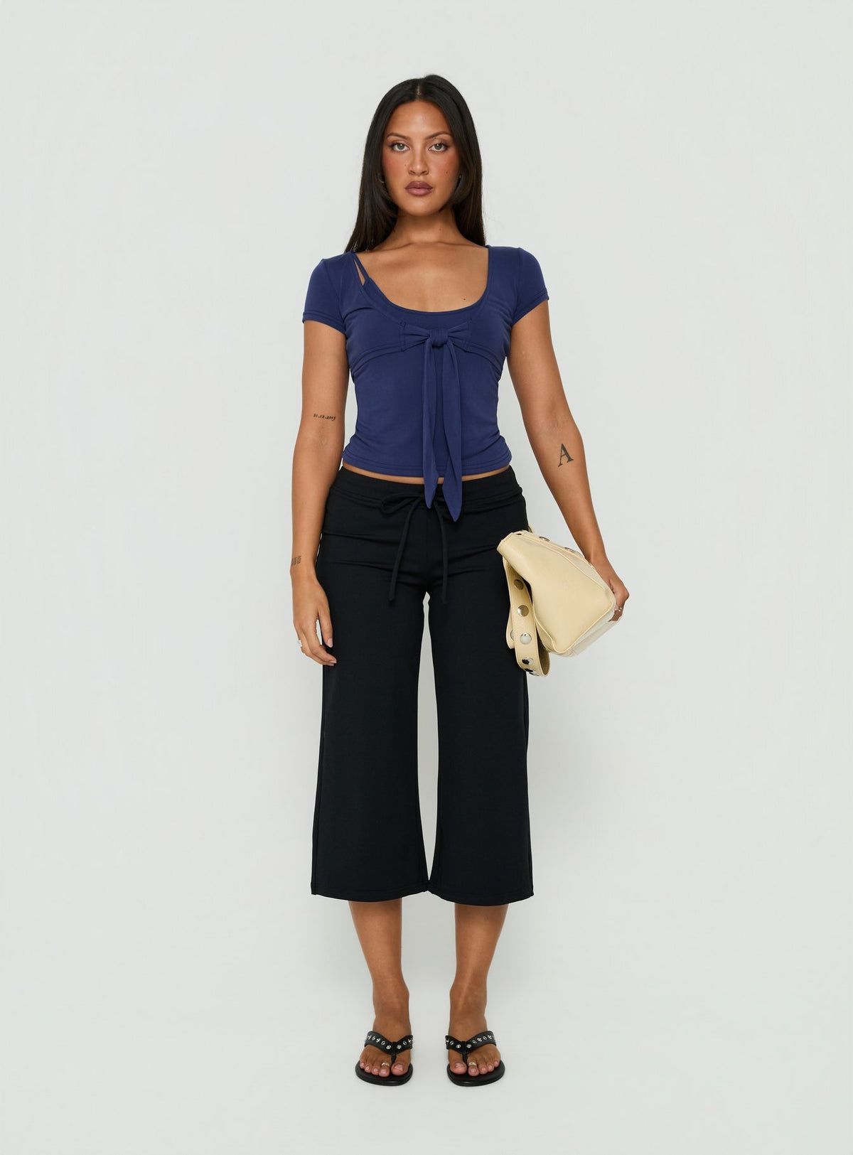 Crafted from Kallora Low Rise Wide Leg Capris Black womens-regular-pants detail view of model wearing Princess Polly