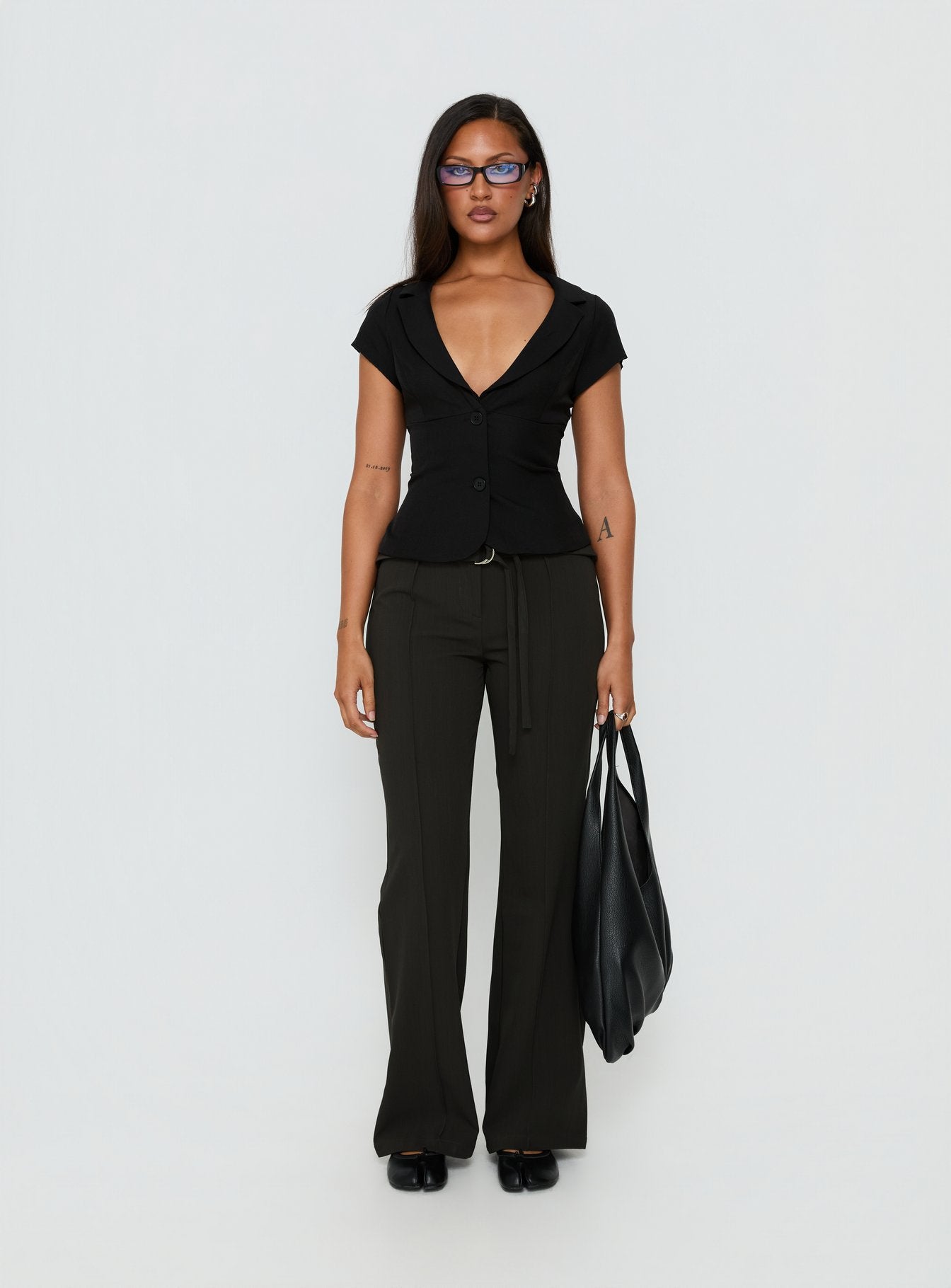Featuring the Belvia Layered Mid Rise Pants Slate Grey womens-regular-pants with wide-leg silhouette and belt detail front view of model wearing Princess Polly