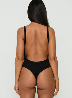 Featuring the Nerinah Ribbed Bodysuit Black womens-bodysuit in sleeveless back view of model wearing