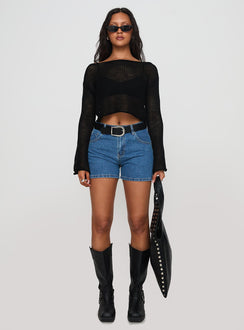 side view of model wearing Princess Polly Saldana Shorts Mid Blue Denim High Waisted Shorts 