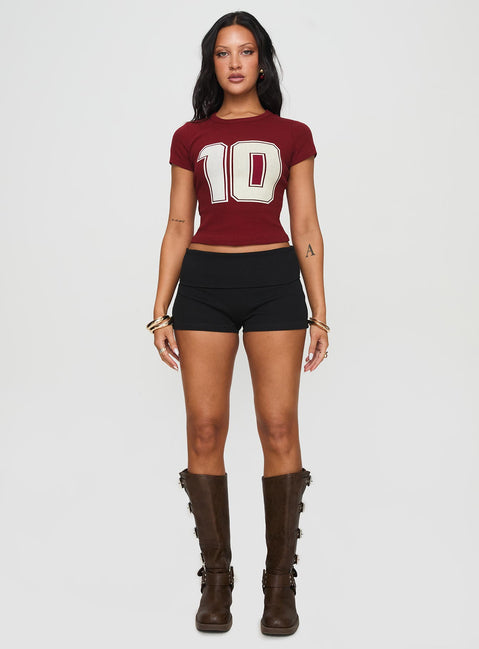 side view of model wearing Princess Polly Baseline Low Rise Rib Shorts Black High Waisted Shorts 