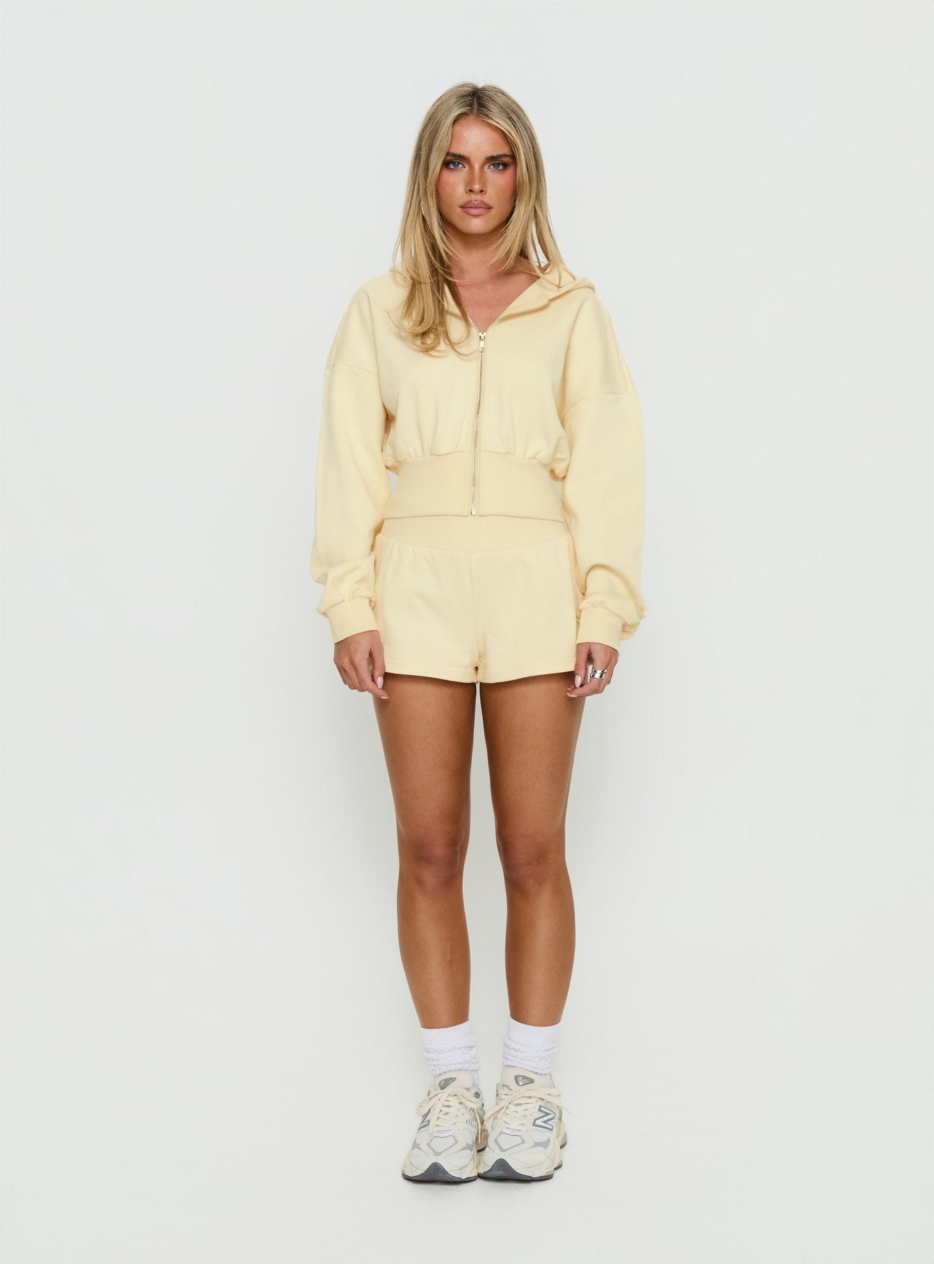 side view of model wearing Princess Polly Daytime Cropped Blouson Hoodie Buttercream Cropped Jumpers 