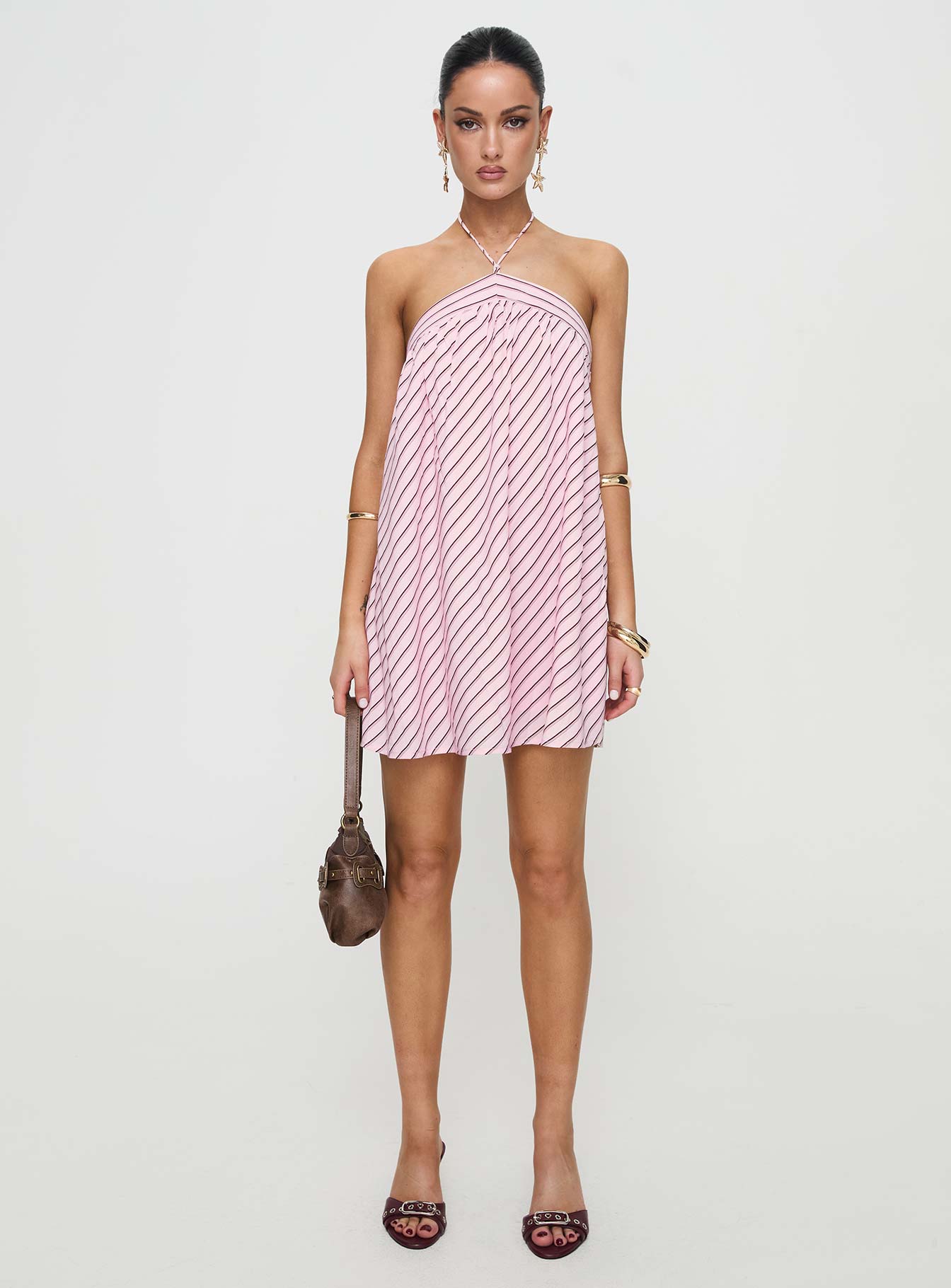 side view of model wearing Princess Polly Moonlit Mini Dress Pink Stripe Asymmetric Neckline 