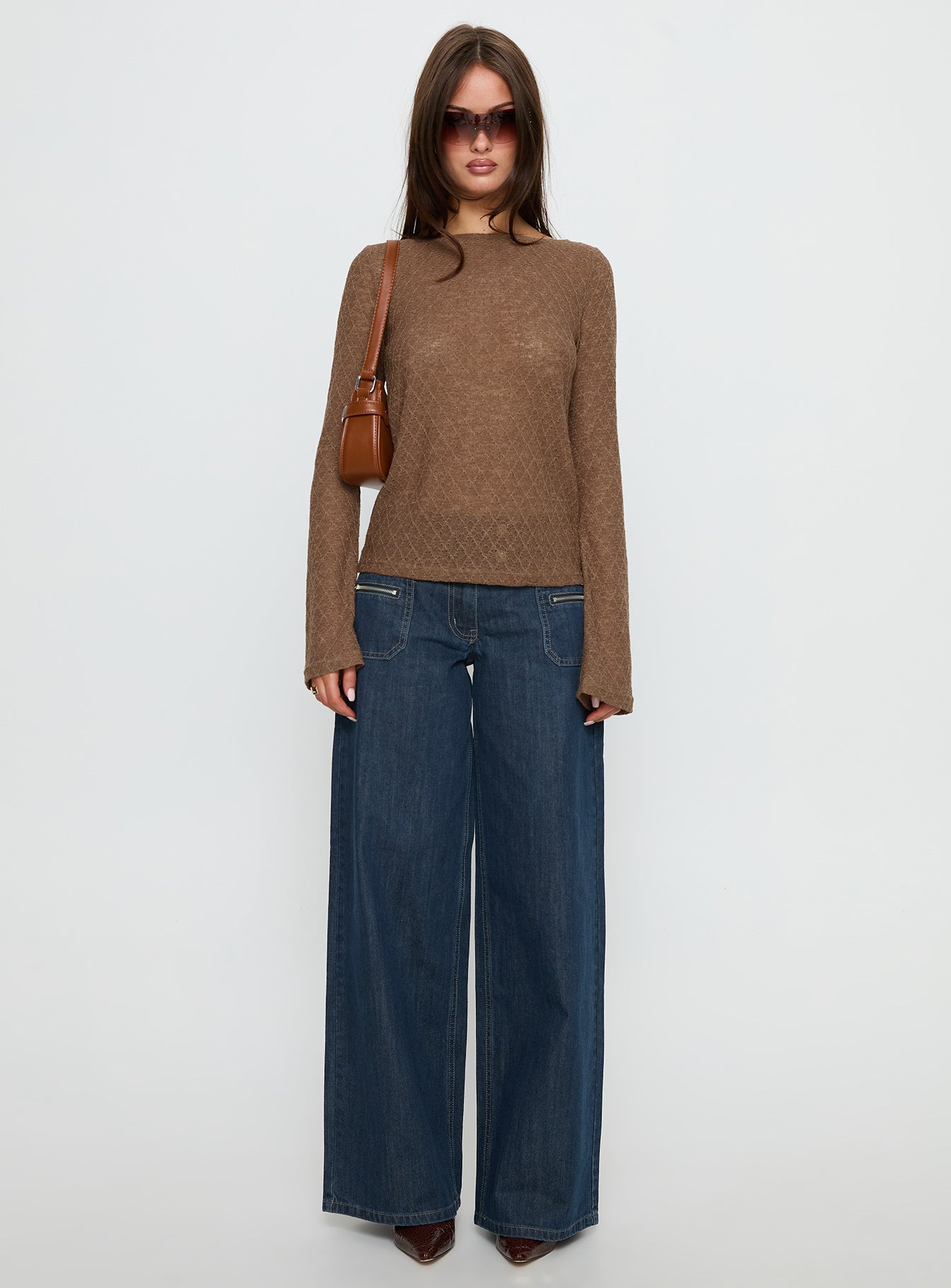 front view of model wearing Princess Polly Unwritten Mid Rise Wide Leg Jeans Dark Blue Wash Mid Rise Jeans 