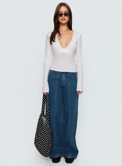 side view of model wearing Princess Polly Lando Low Rise Straight Leg Jeans Mid Blue Wash Mid Rise Jeans 