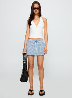 side view of model wearing Princess Polly My Way Skort Blue Gingham Low Rise Shorts 