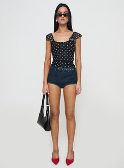 side view of model wearing Princess Polly Halston Briefs Blue Denim High Waisted Shorts 