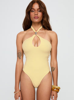 Showcasing the Dulce Vita Hardware Detail Bodysuit Lemon in womens-bodysuit with sleeveless design front view of model wearing Princess Polly