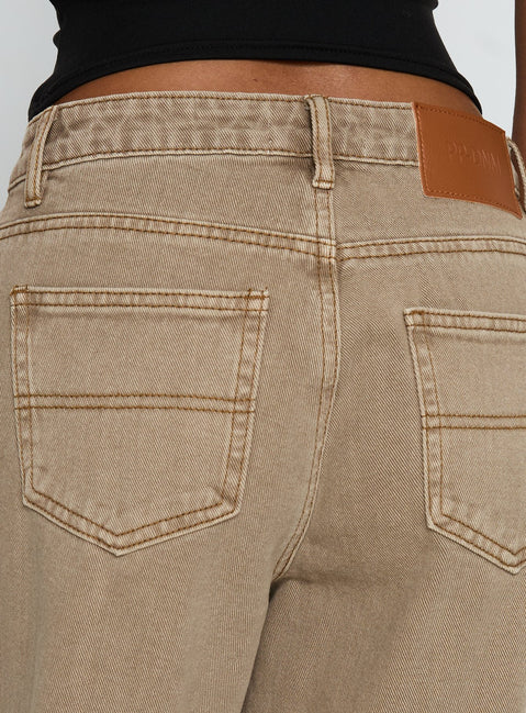 side view of model wearing Princess Polly Naylor Mid Rise Wide Leg Jeans Light Brown Wash Mid Rise Jeans 