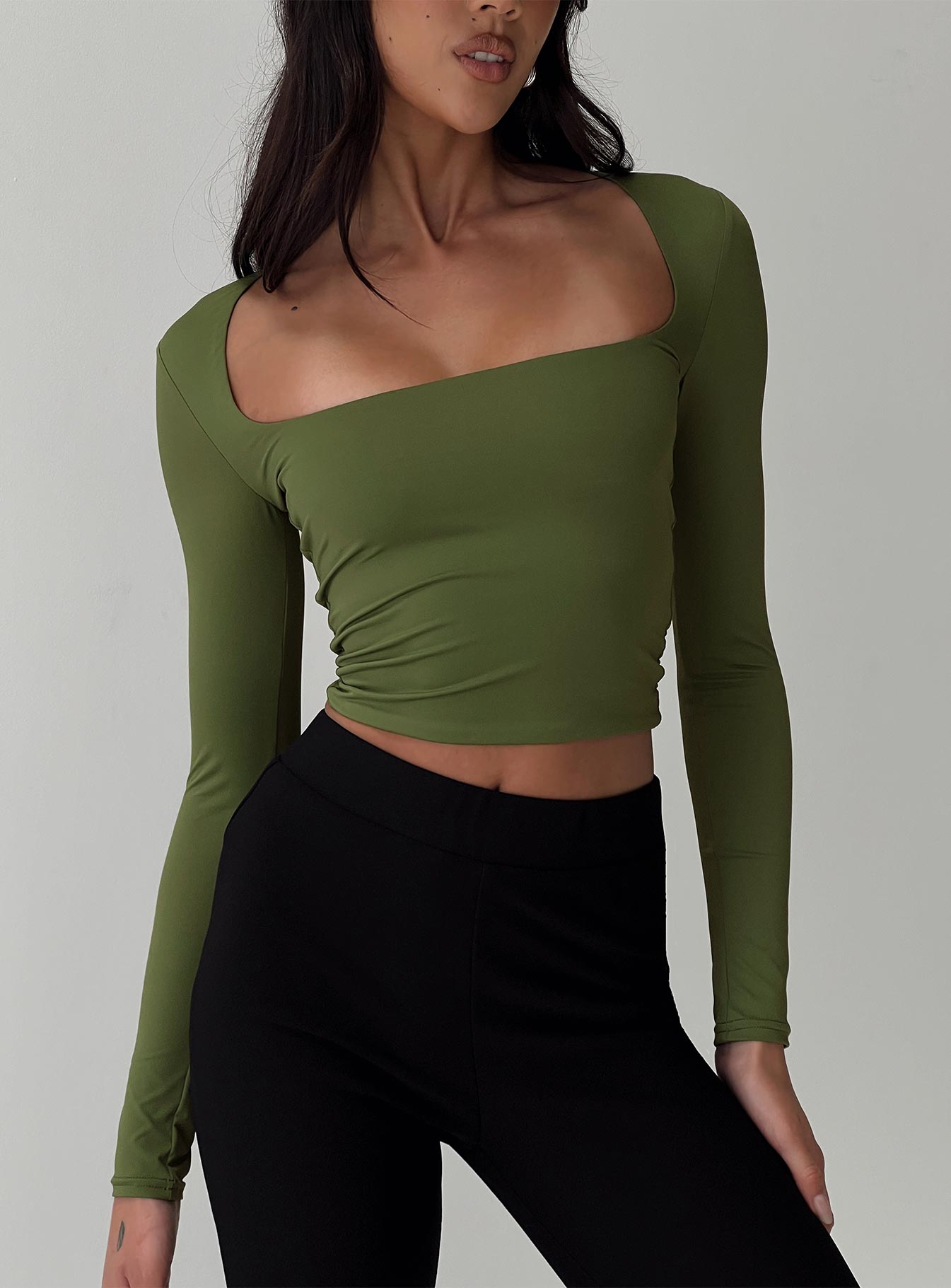 front view of model wearing Princess Polly Back In Time Long Sleeve Top Olive Full Sleeves Square Neck 