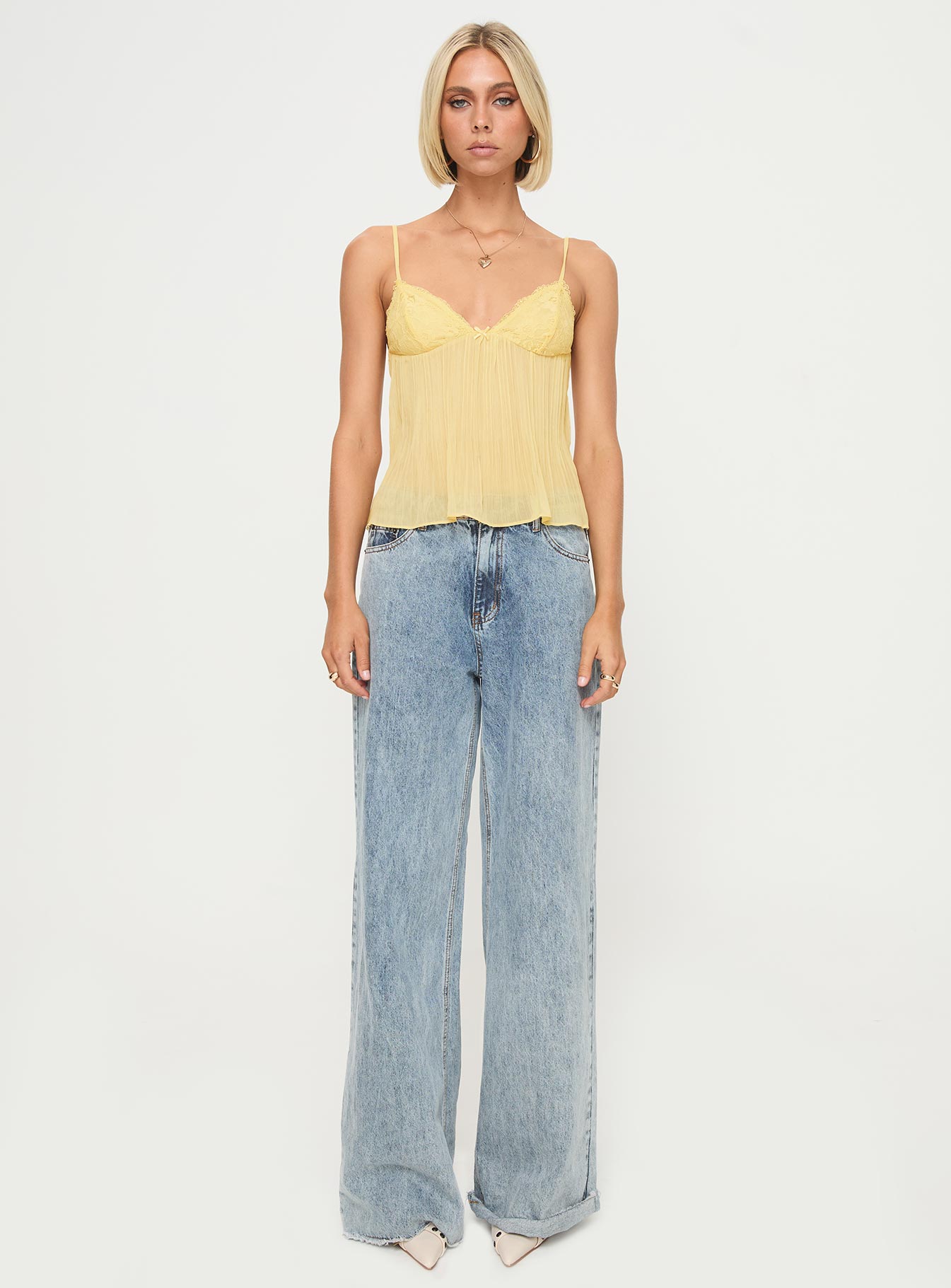 front view of model wearing Princess Polly Zami Pleat Top Lemon Sleeveless Plunger 