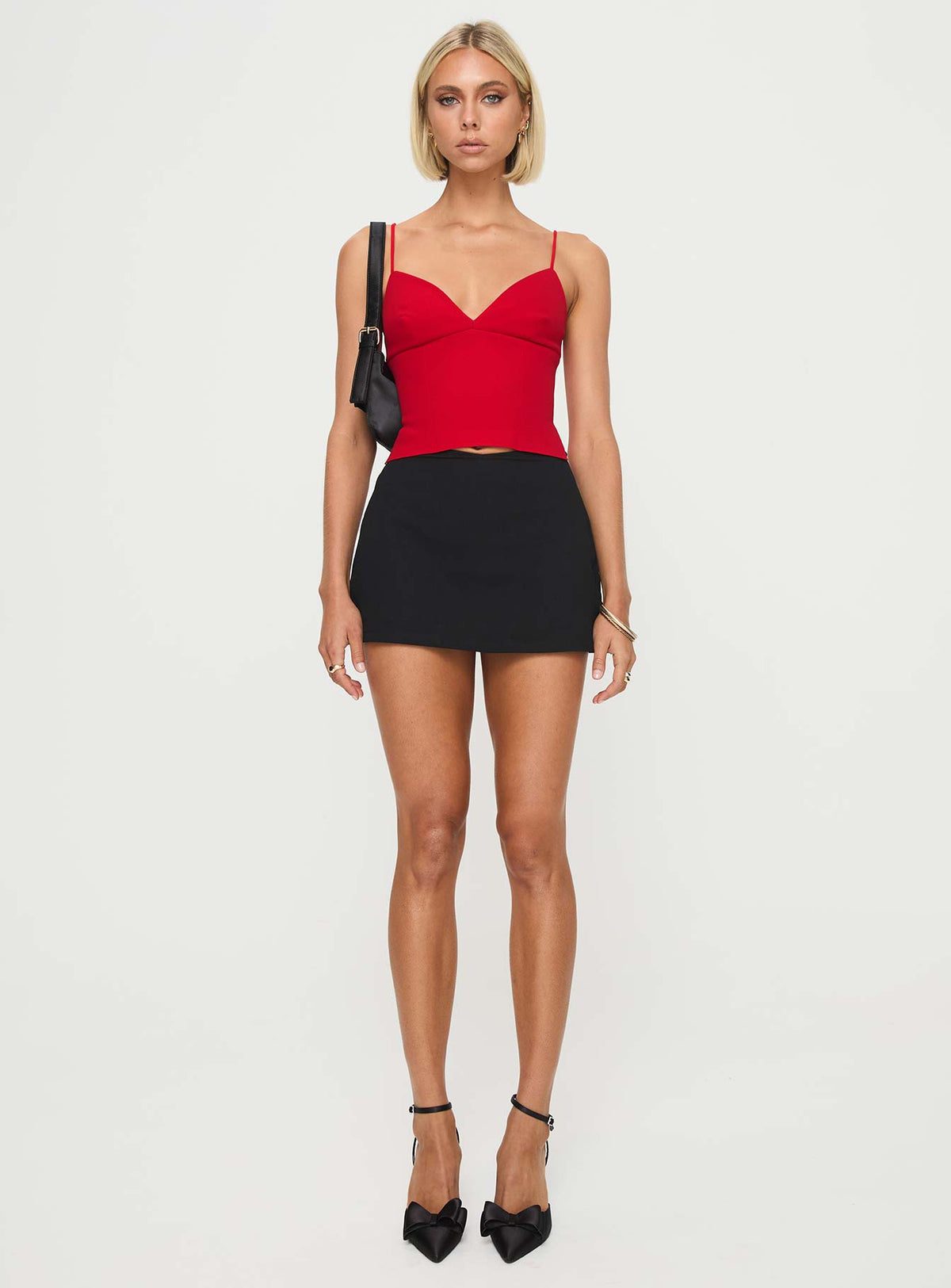 side view of model wearing Princess Polly Sculpture Top Red Sleeveless Plunger 