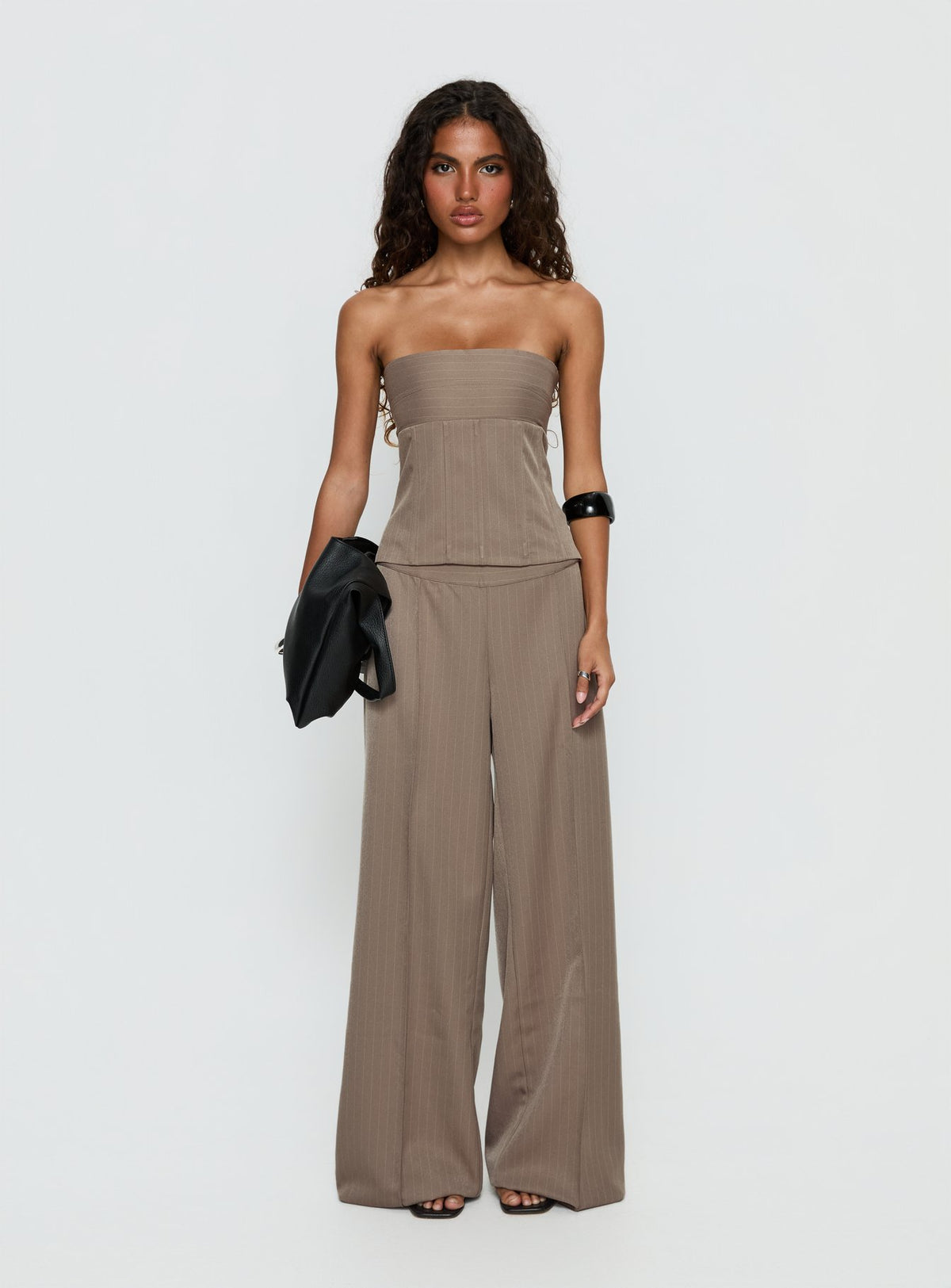 front view of model wearing Princess Polly Madelle Mid Rise Straight Leg Pants Brown Pinstripe Mid Rise Pants 