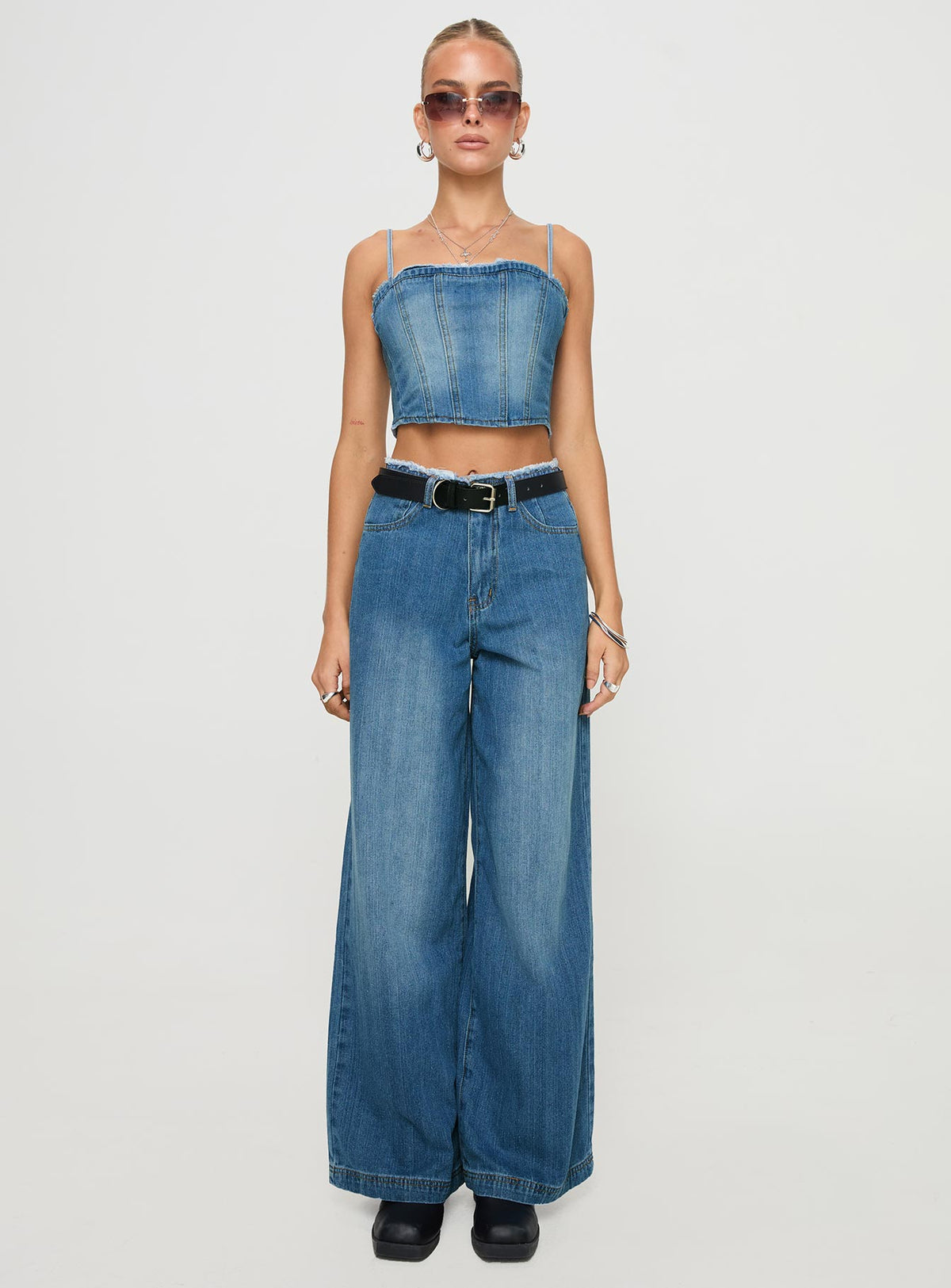 side view of model wearing Princess Polly Vihaan Top Blue Wash Sleeveless Square Neck 