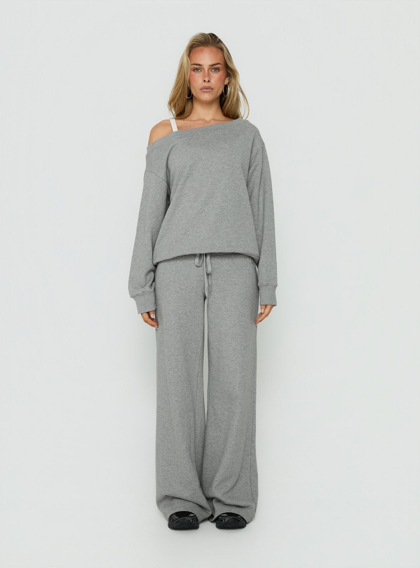 Showcasing the Wellness Off The Shoulder Jumper Dark Grey Marle in womens-jumpers with long length and oversized fit front view of model wearing Princess Polly