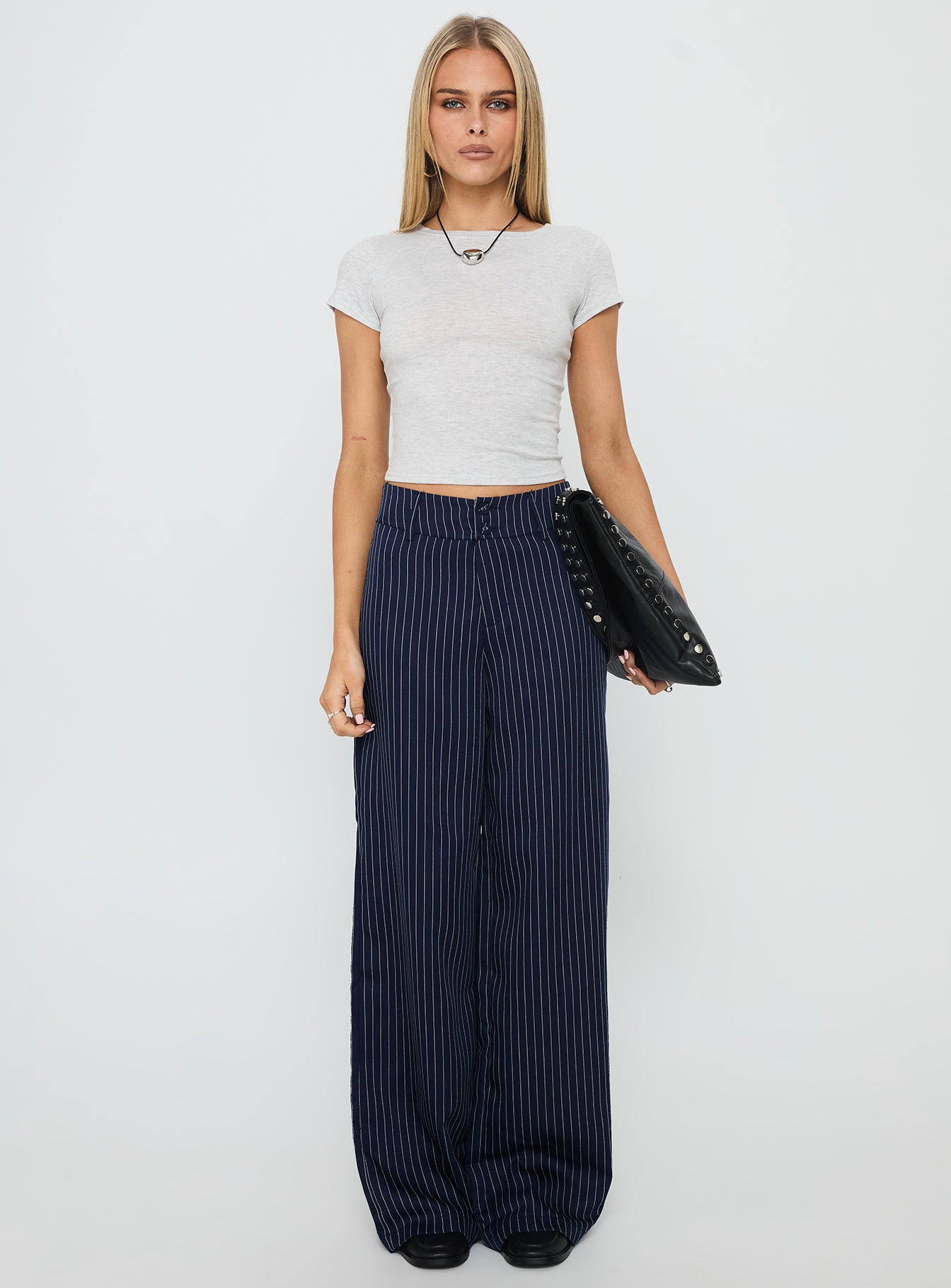 front view of model wearing Princess Polly Lorenne Mid Rise Pant Navy Pinstripe High Waisted Pants 