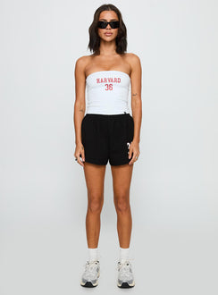 side view of model wearing Princess Polly Harvard Soffee Shorts Black High Waisted Shorts 
