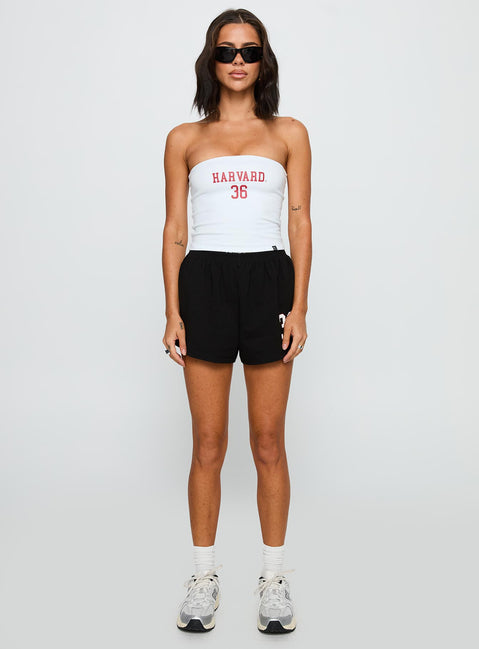 side view of model wearing Princess Polly Harvard Soffee Shorts Black High Waisted Shorts 