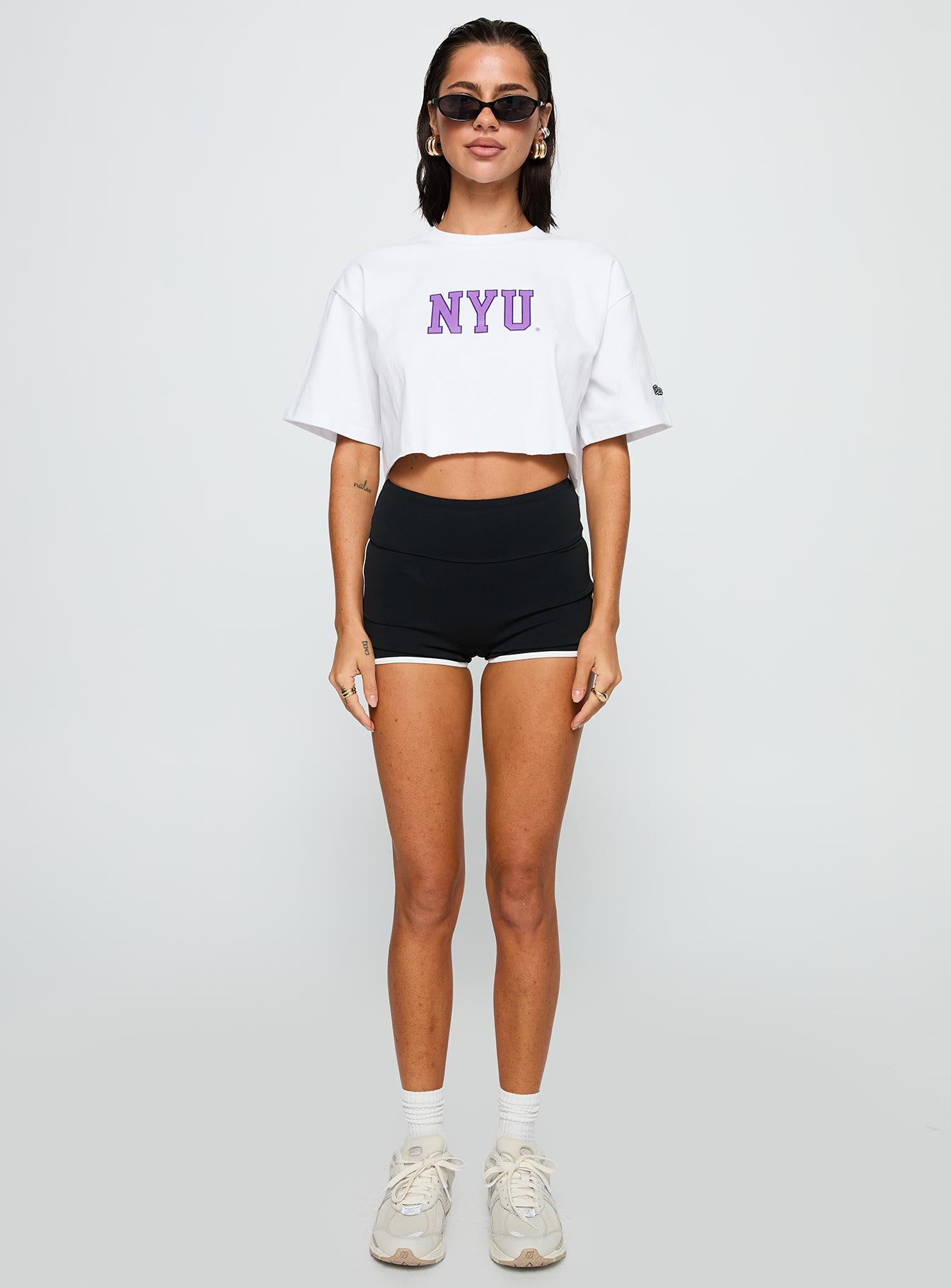 side view of model wearing Princess Polly Nyu Track Tee White Half Sleeves Crew Neck 