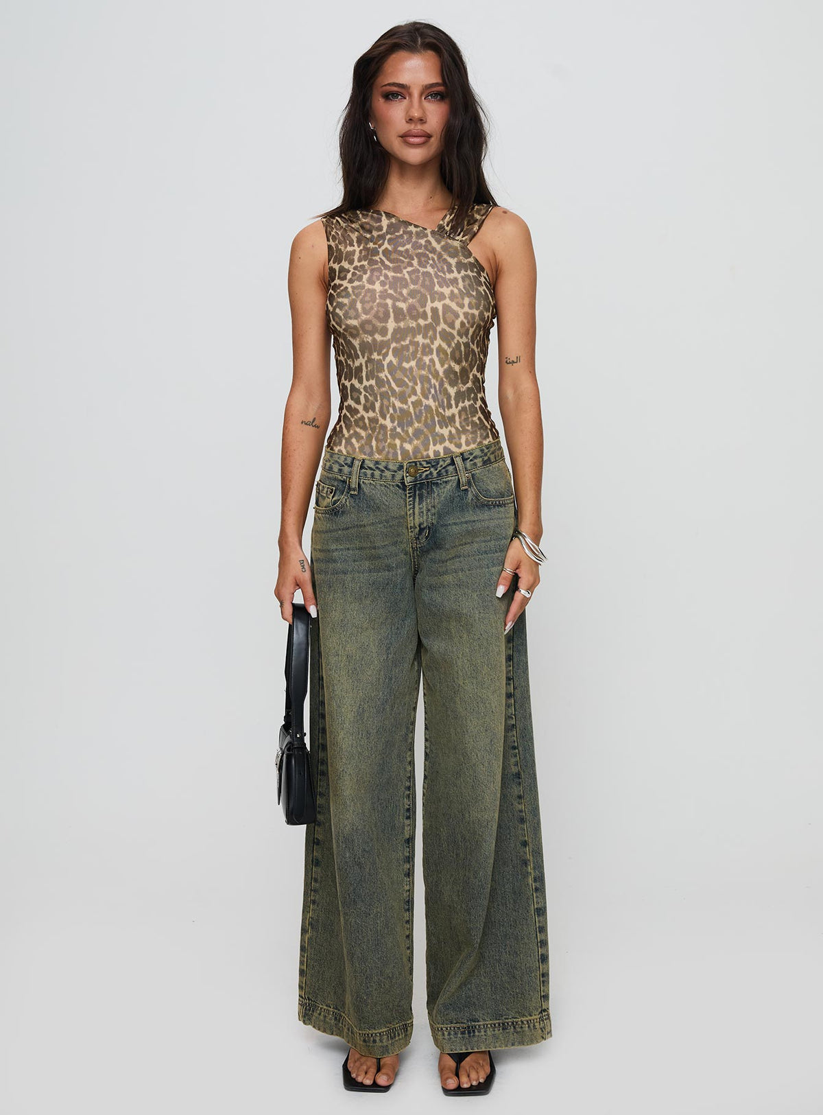 side view of model wearing Princess Polly Serenata Bodysuit Leopard Sleeveless 