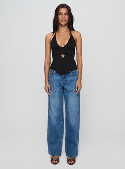 front view of model wearing Princess Polly Serenitia Mid Rise Relaxed Jeans Mid Blue Wash Tall Mid Rise 