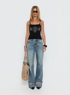 back view of model wearing Princess Polly Ezia Wide Cuff Baggy Jeans Raw Denim Mid Rise Jeans 