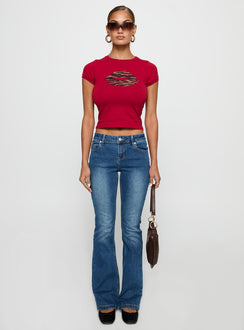 side view of model wearing Princess Polly Sutin Tee Red Short Sleeves Crew Neck 