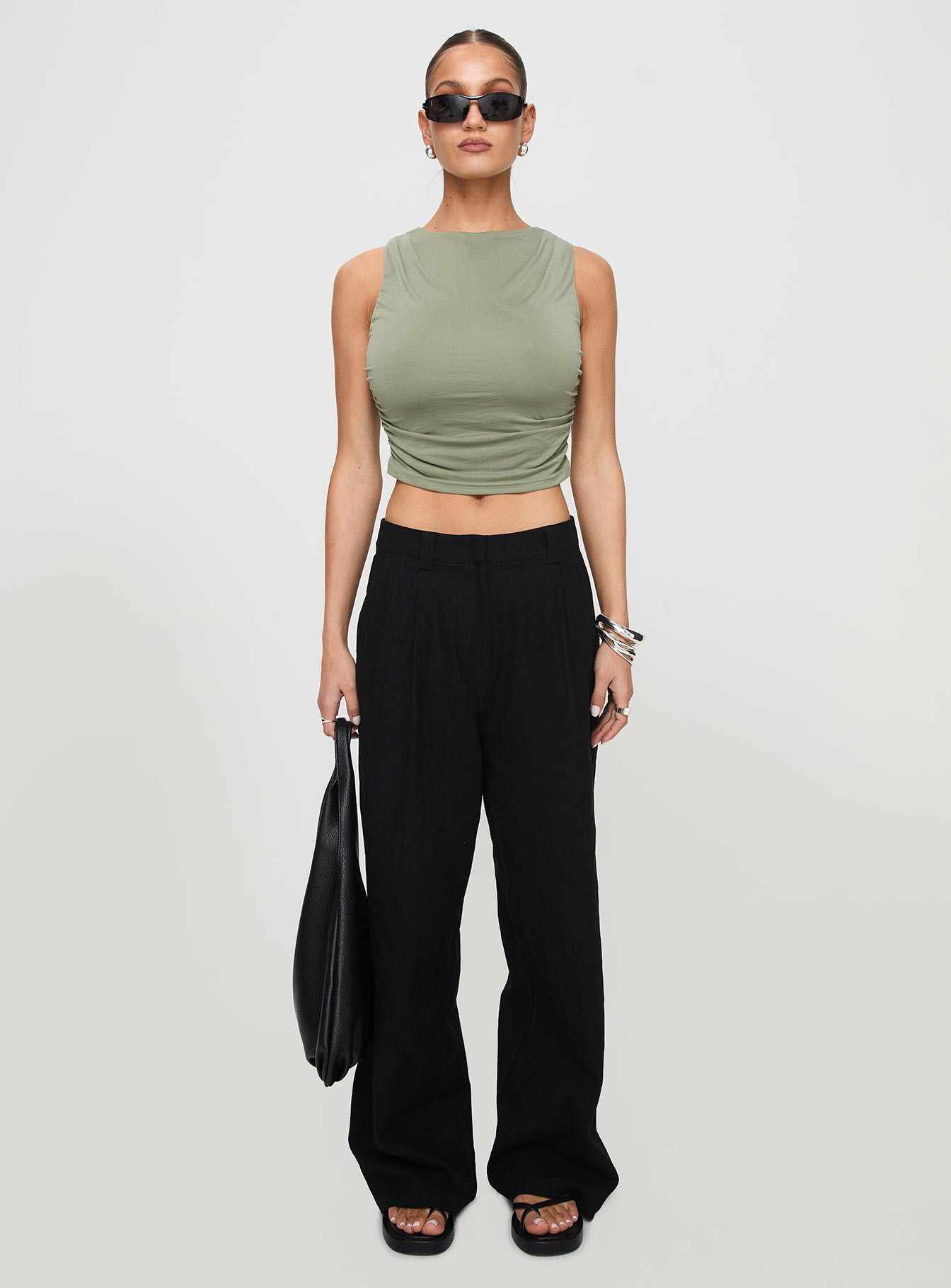 front view of model wearing Princess Polly Hold Em High Neck Top Green Sleeveless Crew Neck 