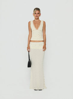 Crafted from jersey fabric the Zespri Maxi Skirt in Cream Polka Dot for womens-skirts with fitted a-line shape and lace hem front view of model wearing Princess Polly