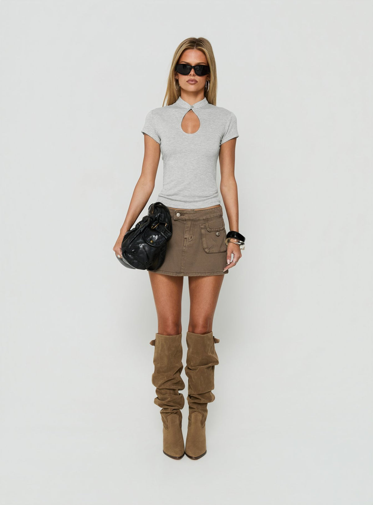 Showcasing the Tarza Cargo Mini Skirt Khaki womens-skirts in mini length front view of model wearing