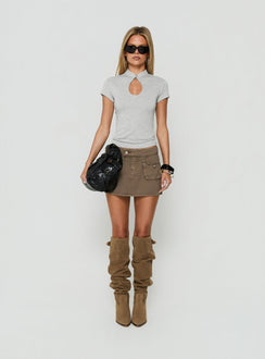 Showcasing the Tarza Cargo Mini Skirt Khaki womens-skirts in mini length front view of model wearing