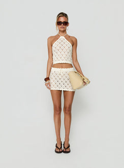 Discover the Harrietah Crochet Tie Waist Mini Skirt in white, a women's fitted aline skirt featuring mini length front view of model wearing Princess Polly