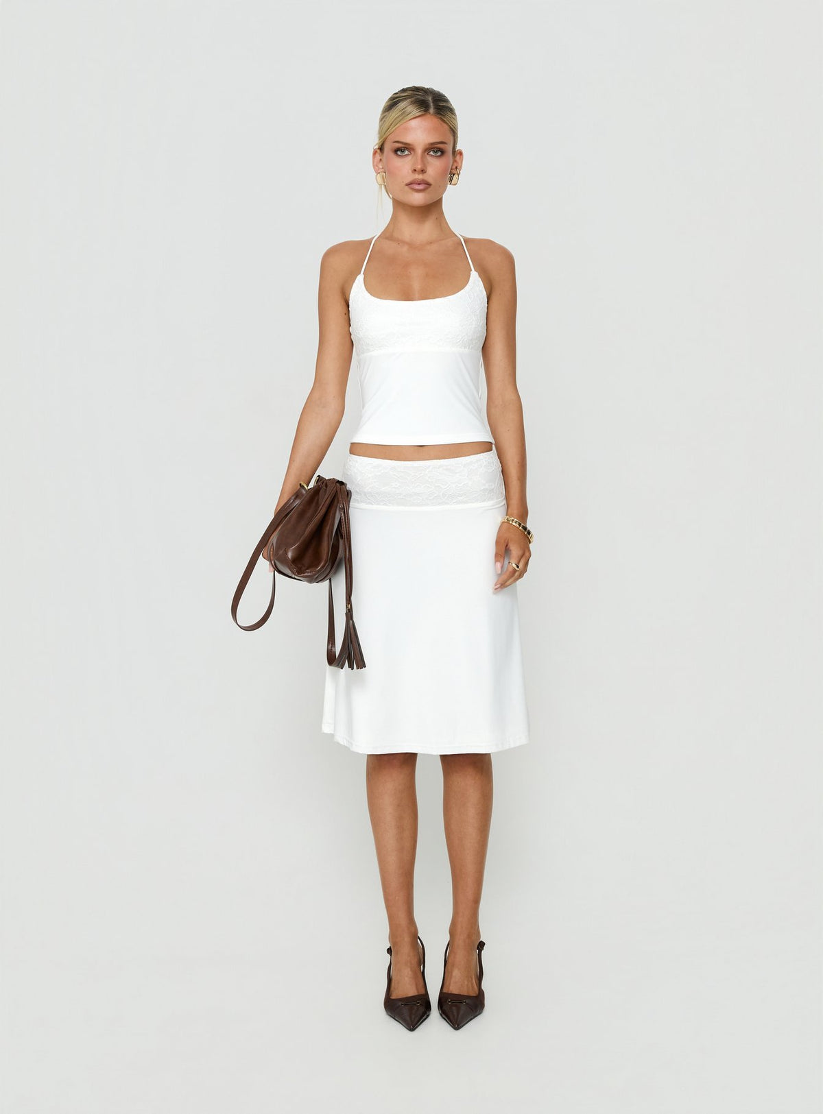 Showcasing the Zenaide Lace Detail Midi Skirt White womens-skirts with midi length front view of model wearing Princess Polly