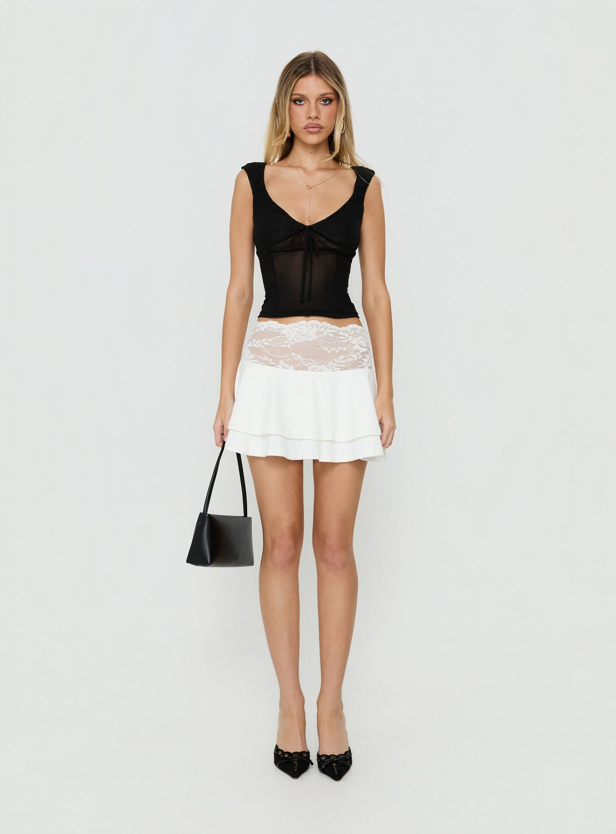 Showcasing the Kecia Lace Waistband Mini Skirt White in womens-skirts featuring mini length front view of model wearing Princess Polly