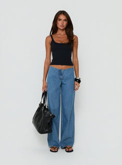 Showcasing the Hereos Mid Rise Baggy Leg Jeans in Bright Blue Wash, womens jeans with mid-rise waist and belt detail, front view of model wearing Princess Polly