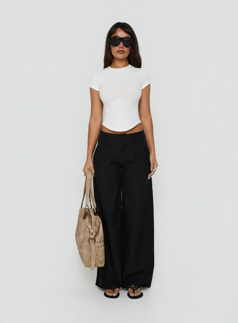 Featuring Loved Up Low Rise Baggy Pants Black in womens regular pants front view of model wearing Princess Polly